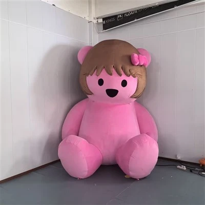 Lindo oso rosa inflable con lazo